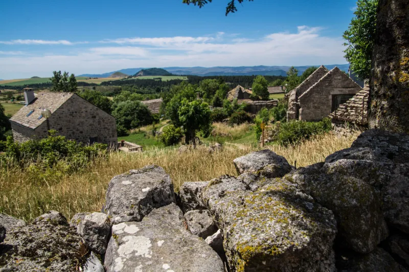 a beautiful shot of old stone houses in la fage-saint-julien, lozere, france