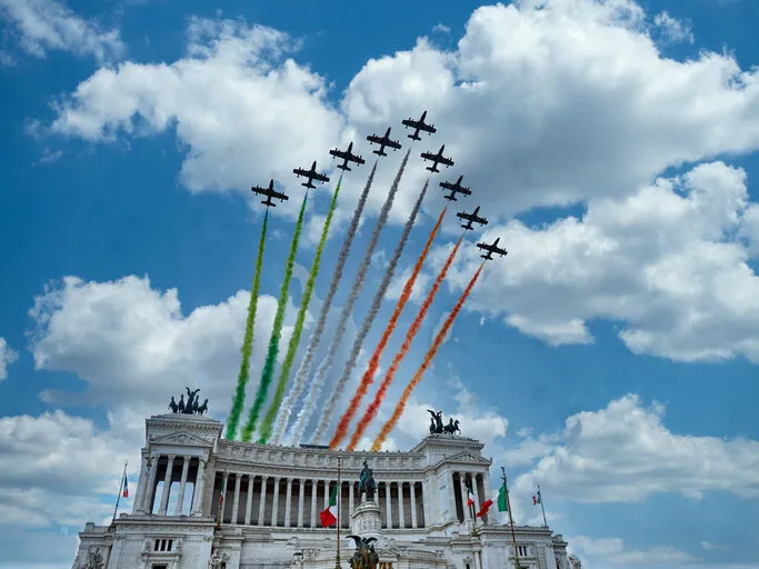 italian national republic day air show aerobatic team frecce tricolore flying over altare della patria in rome, italy