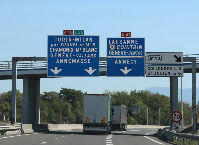 road signs on the french motorway to reach italy through the mont blanc tunnel