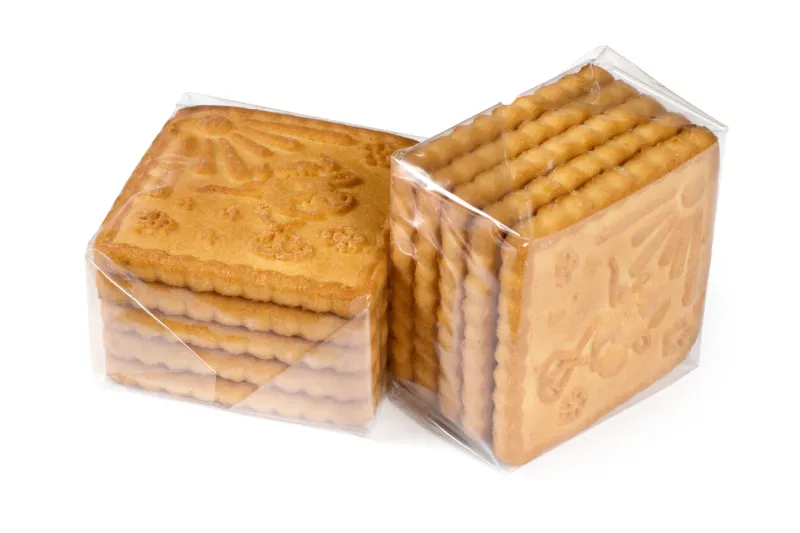 two packs of biscuits in a transparent package biscuits on a white background