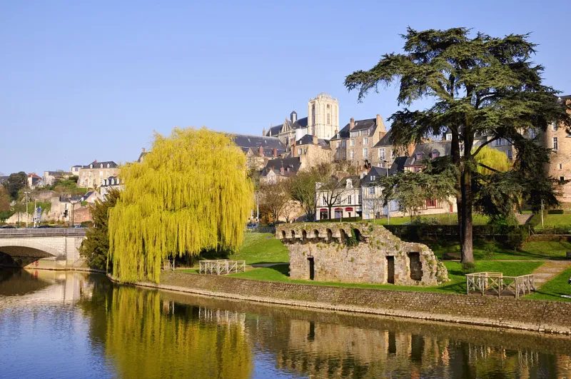 the river sarthe and weeping willow and the ruins of old fortification at le mans of the pays de la loire region in north-western france