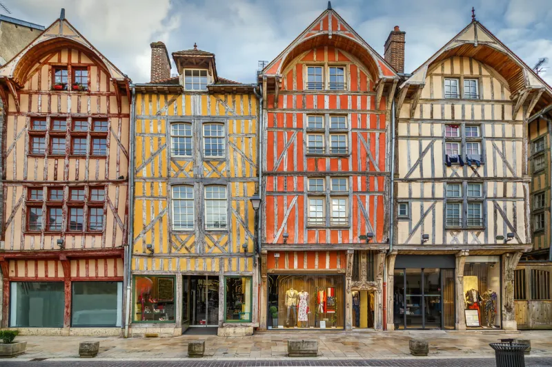 strret with historical half-timbered houses in troyes downtown, france