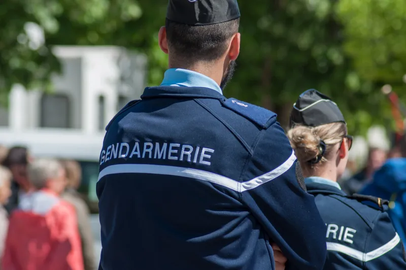 brisach - france - 1 may 2018 - french gendarmerie patrol in lily of the valley party in the street