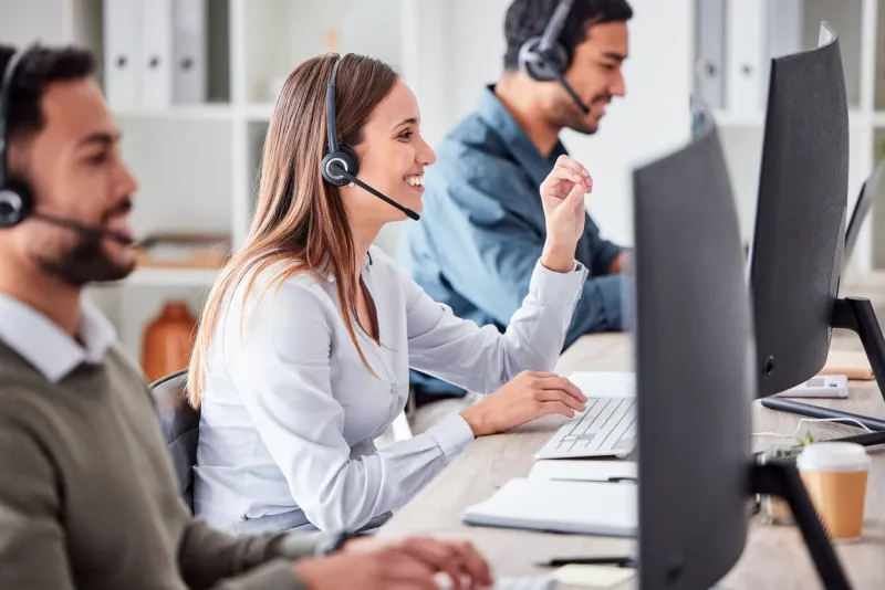 cropped shot of an attractive young female call center agent working in her office