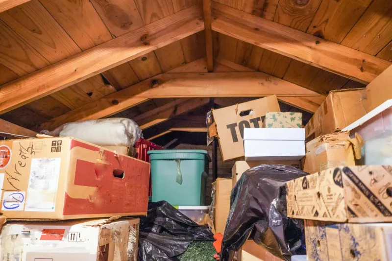 a disorganized attic loft, or crawl-space above the residential garage