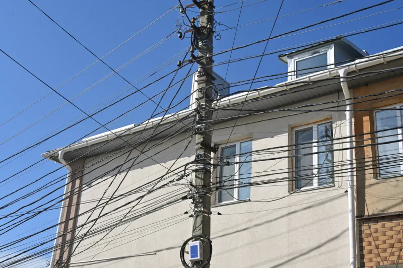 electric wires on a pole, many cables and wires on an electric pole