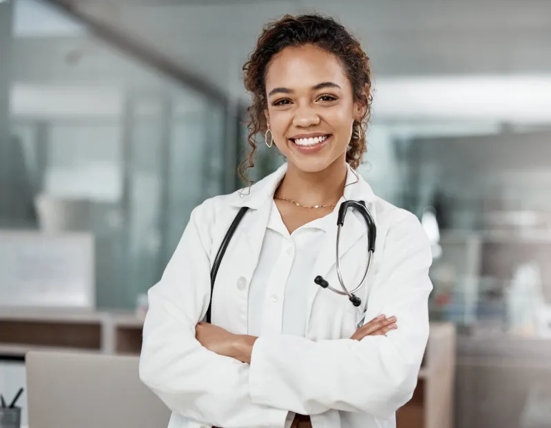 cropped portrait of an attractive young female doctor standing with her arms folded in the office