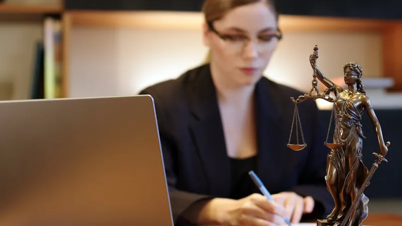 female lawyer at laptop working on research, brainstorming on career issues business man, boss or executive at computer with focus on corporate inspiration or vision