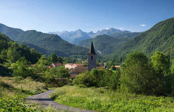 mountain landscape in the south of france with a steeple in the foreground