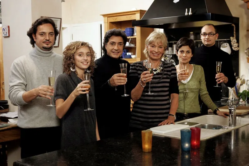 frederic francois poses with family at home
