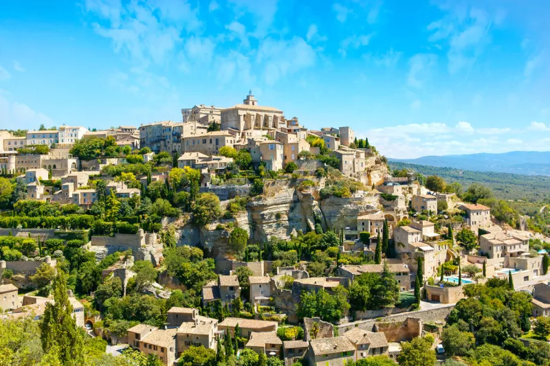 view on gordes, a small typical town in provence, france beautiful french village, with view on roof and landscape on sunny summer day