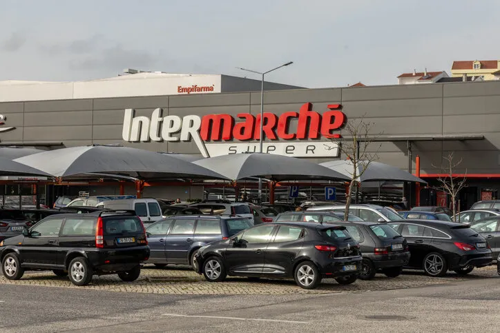 lisbon, portugal 11 december 2023 intermarche logo sign at the store intermarché (english  intermarket) is a brand of general commercial supermarkets or grocery