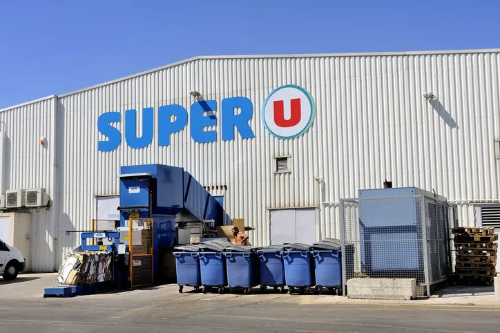 grau-du-roi, france - september 1, 2014  compaction of waste and packaging from a supermarket for recycling cardboard and other recyclable materials