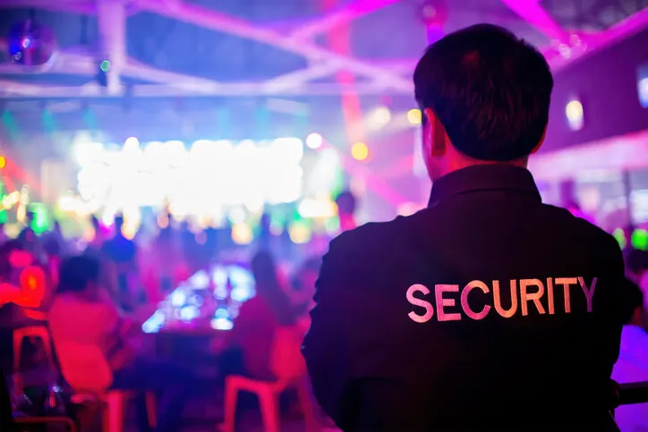security guard are regulating the situation of safety in an event concert in a nightclub