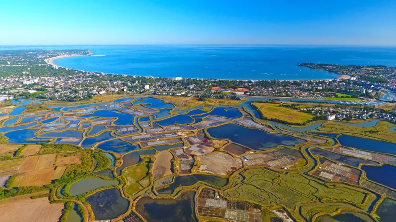 an aerial view of la baule from guerande salt marshes