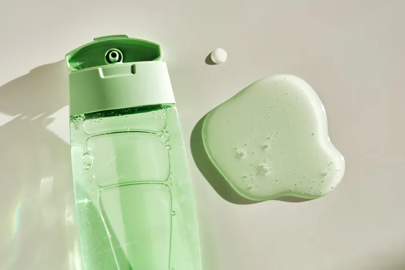 shower gel or shampoo on a white background with sun light high quality photo