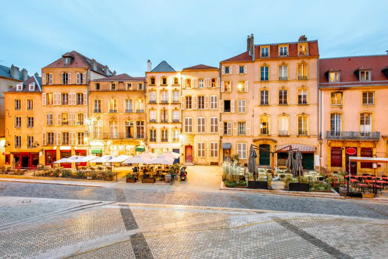 street view on the beautiful old residential buildings in the center of metz old town during the twilight in france