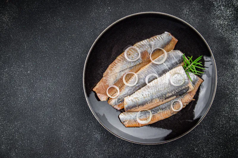 herring fresh salted fish tasty seafood healthy eating cooking appetizer meal food snack pescetarian diet on the table copy space food background rustic top view