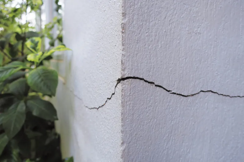 cracked concrete building wall at the outside corner that effected with earthquake and collapsed ground