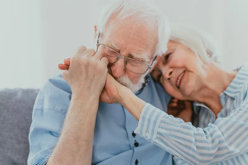 senior couple together at home, happy moments - elderly people taking care of each other, grandparents in love - concepts about elderly lifestyle and relationship
