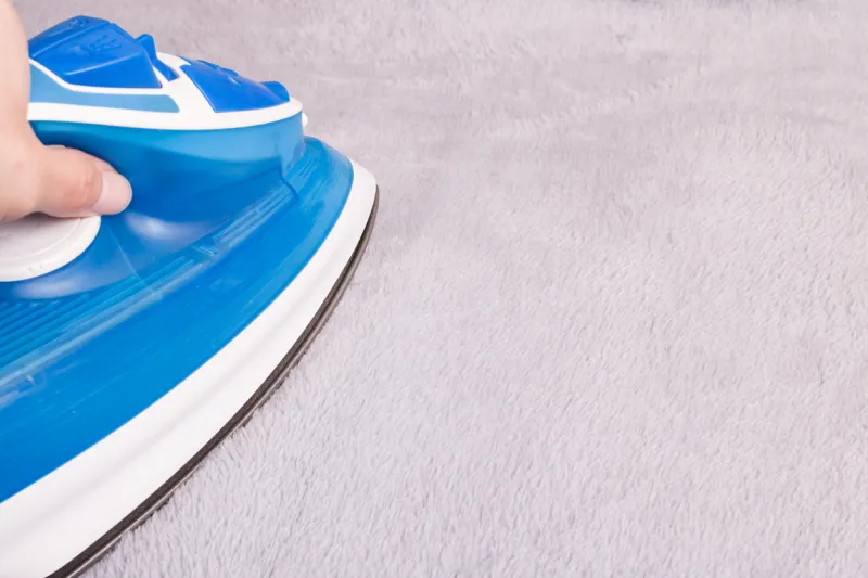 Fer à repasser moquette