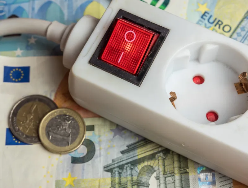 a power plug and many euro bills