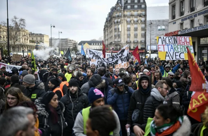 protesters take part in a demonstration near gare de l'est train station in paris on december 26, 2019, as part of a nationwide multi-sector strike against french government's pensions overhaul (photo by stephane de sakutin   afp)