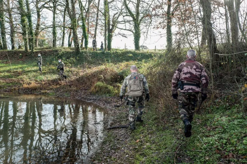 french gendarmes search the area around the roucarie lake in monesties, southern france, on december 22, 2020, for delphine jubillar, a 33 year-old nurse, mother of two, who went missing overnight on december 15 (photo by fred scheiber   afp)