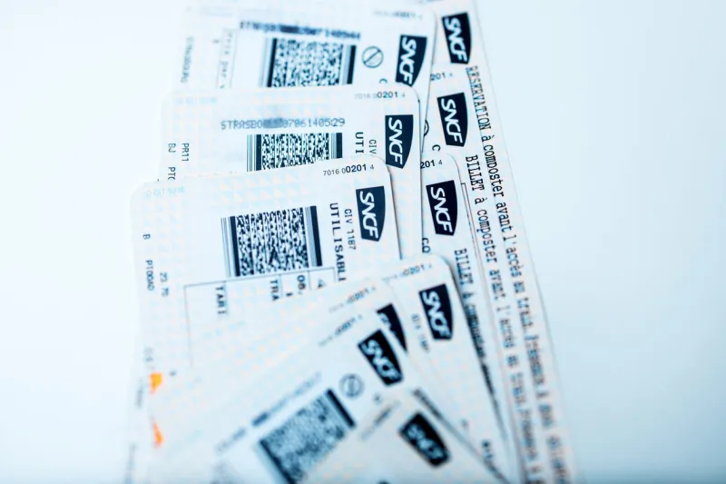paris, france - january 14, 2015  train tickets for sncf - societe nationale des chemins de fer francais or national society of french railways on white bakground for mutiple destinations on tgv