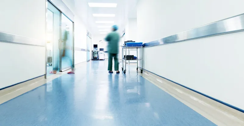 doctors and nurses walking in the hospital hallway