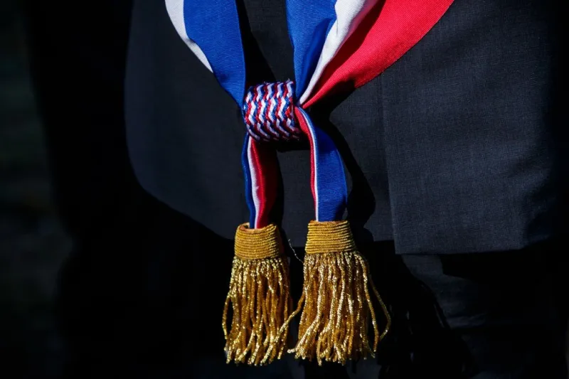 a local official wearing the tri-color scarf waits for the french president ahead of a visit to the villa viardot as part of the french heritage days in bougival, near paris, on september 15, 2018 (photo by christophe petit tesson   pool   afp)