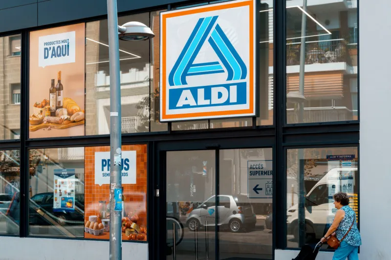 barcelona, spain-august 16, 2022 logo and facade of aldi, german discount supermarket chain the first store was opened in essen by brothers karl and theo albrecht in