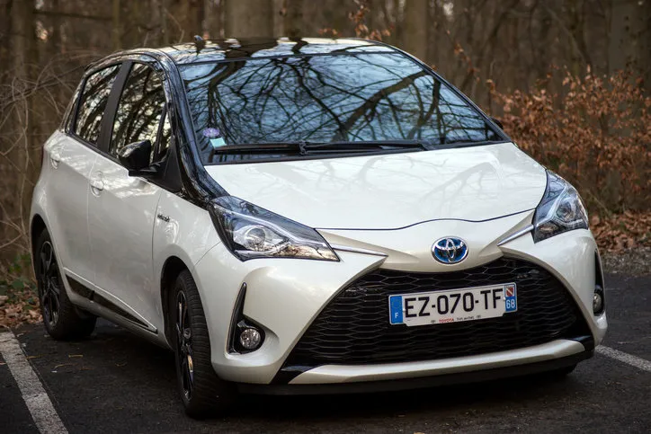 mulhouse - france - 18 february 2020 - front view of pearly tpyota yaris parked in border forest