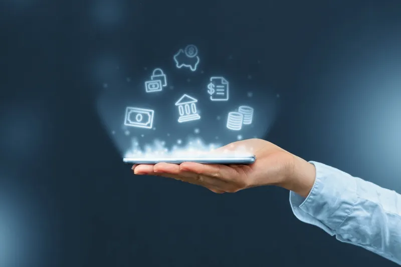 person holds a smartphone with mobile banking icons projection