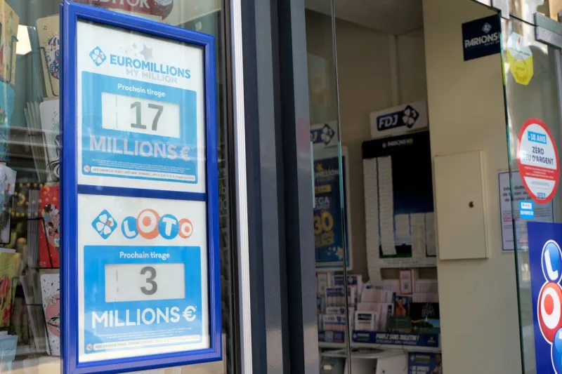 vannes, france, june 14, 2022  signs of loto and euromillions winnings on the window of a tobacco shop in france