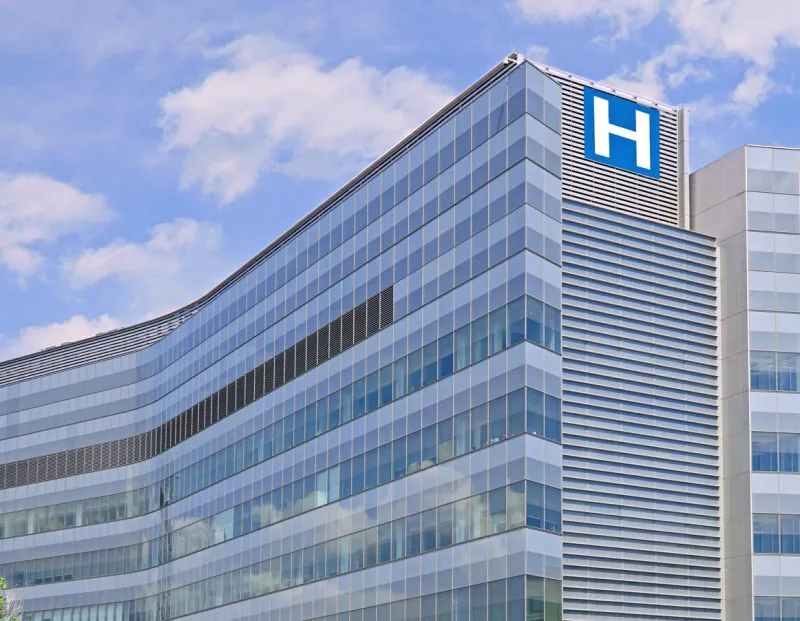 building with large h sign for hospital