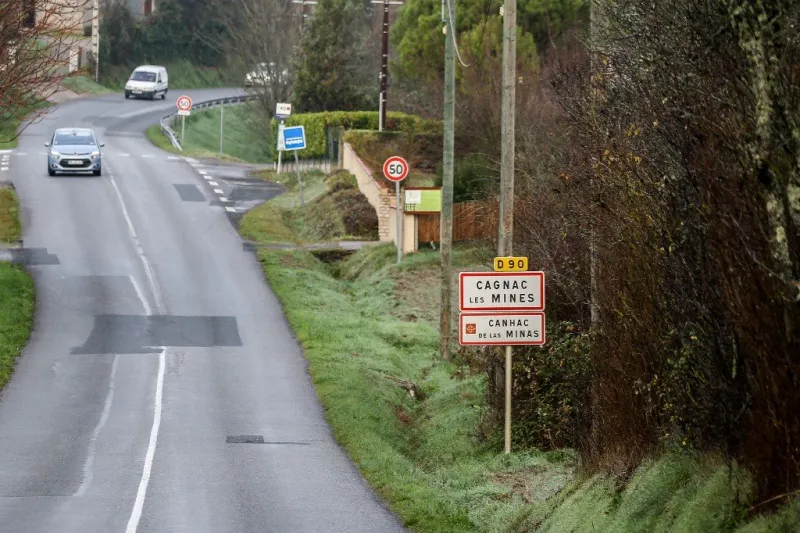 cars drive at an entrance of the village of cagnac-les-mines on december 22, 2020, where delphine jubillar, a 33 year-old nurse, mother of two, went missing overnight on december 15 (photo by fred scheiber   afp)