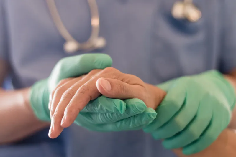 surgeon, physician performs surgical operations, anesthetist or anesthesiologist holding patient's hand ffor checking state of mand or support in er room, medical healthcare concept