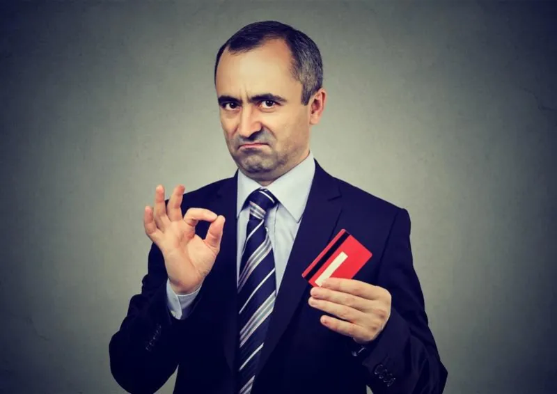 sly liar businessman employee reassuring their credit card is the best