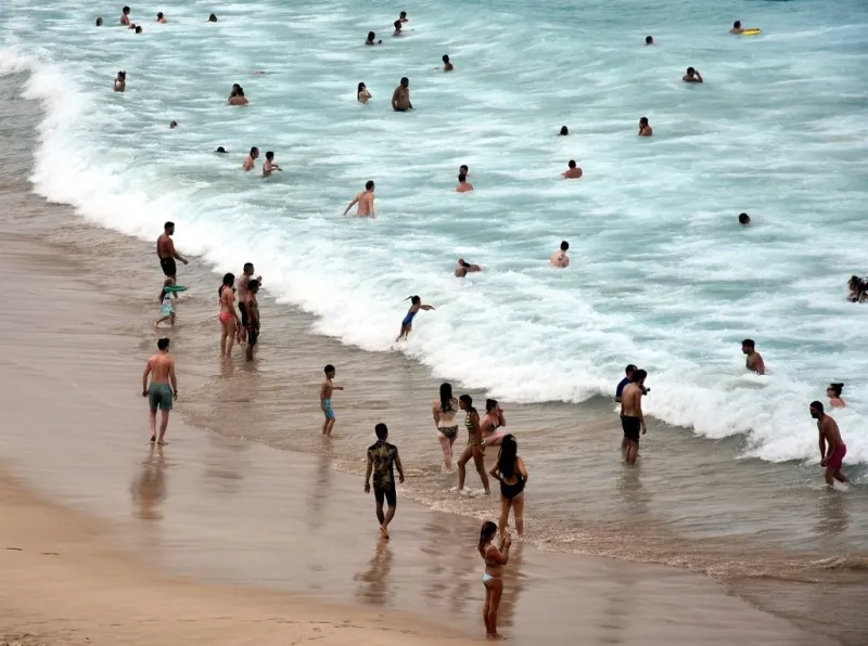 sydney, australia - feb 5, 2017 people relaxing, swimming and sun bathing on bondi beach bondi beach is one of the most famous tourist sites in australia