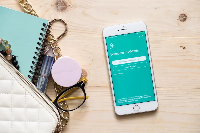 chiang mai, thailand - september 4, 2016  apple iphone 6s plus with airbnb application on the screen airbnb is a website for people to list, find, and rent lodging