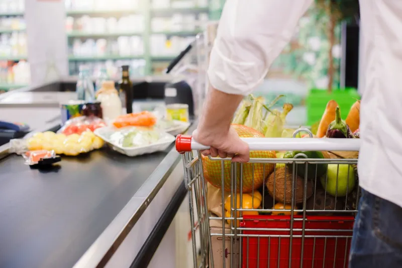 man buying food products in the supermarket shopping
