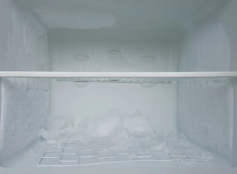 empty old refrigerator with ice need to be defrosted selective focus, close up