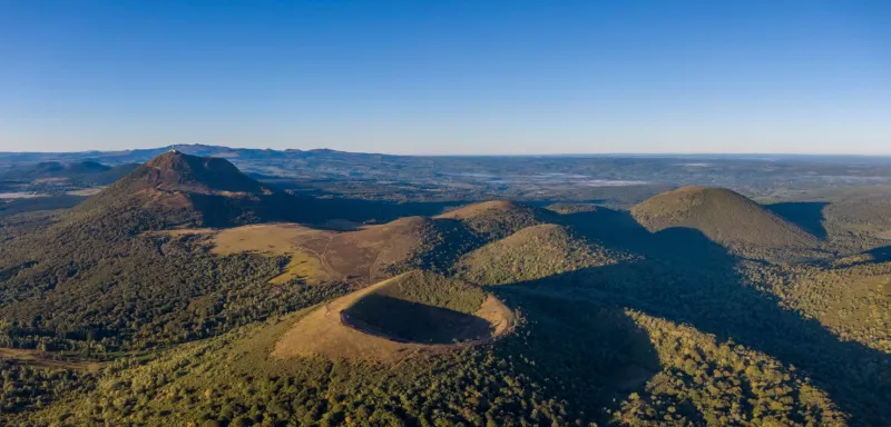 aerial panorama of puy pariou and puy de dome volcanoes, auvergne-rhone-alpes, france