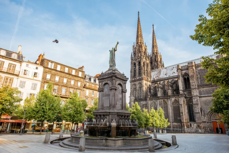 morning view on the victory square with monument and cathedral in clermont-ferrand city in france