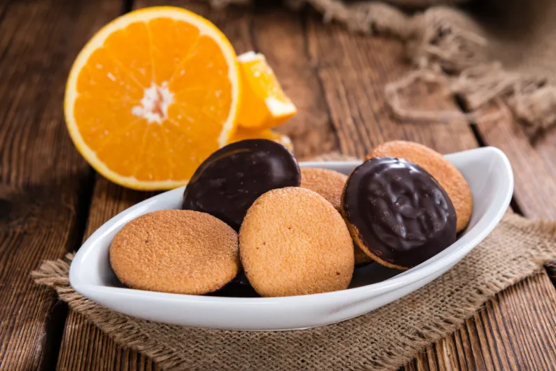 jaffa cakes (orange) as close-up shot on wooden background