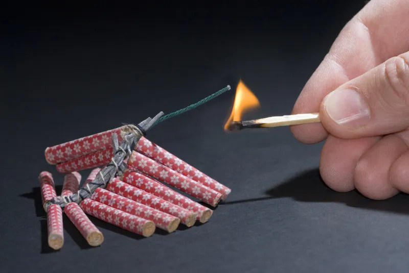 fireworks lit with flame of match