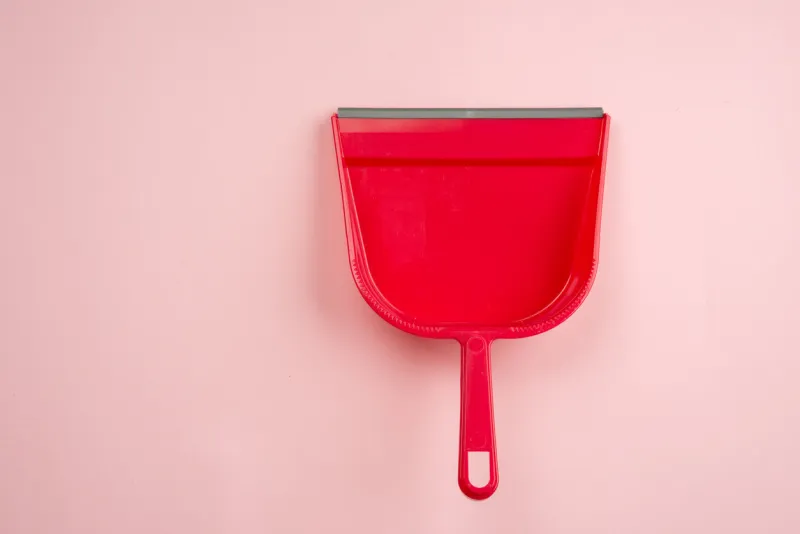 top view of red plastic dustpan isolated on white background