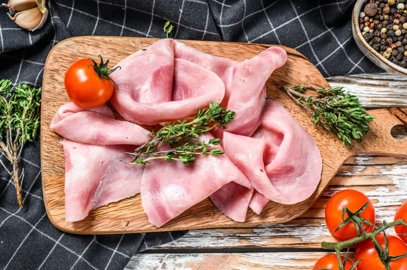 sliced ham fresh prosciutto pork ham sliced white wooden background top view