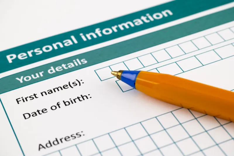 personal information form with ballpoint pen